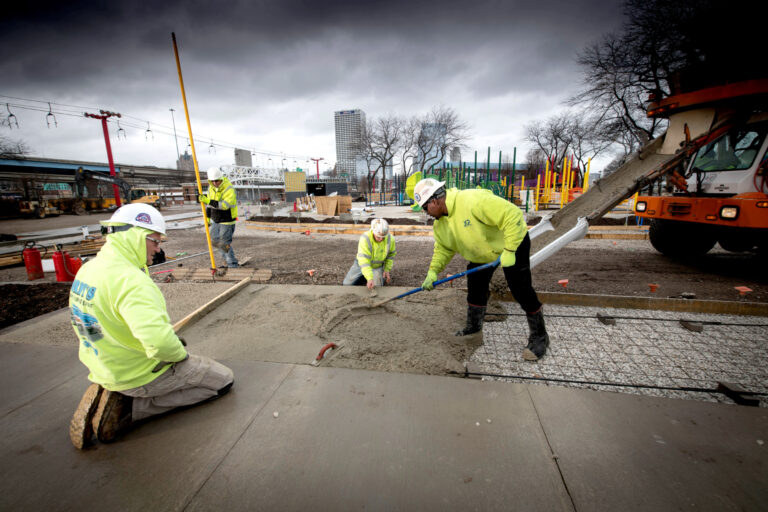 JCP employees laying concrete