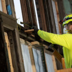 JCP employee installing framing