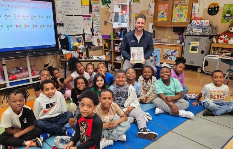 JCP employee reading to a classroom for Read Across America
