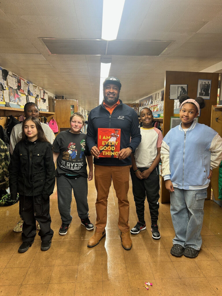 JCP employee with students for Read Across America